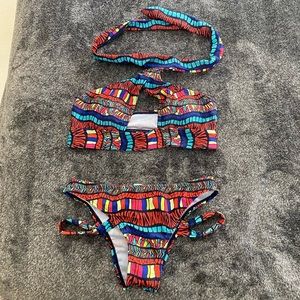 Multi color halter style bikini. NWOT. Size Small